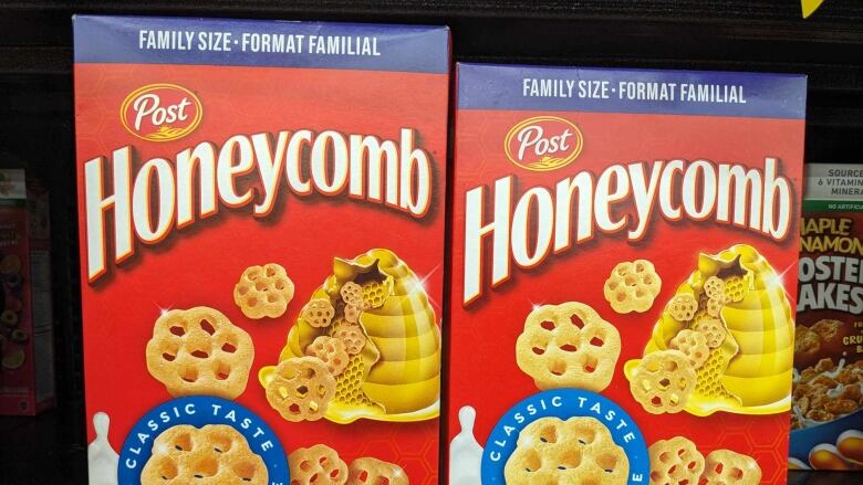 Two boxes of Honeycomb cereal sitting side by side. 