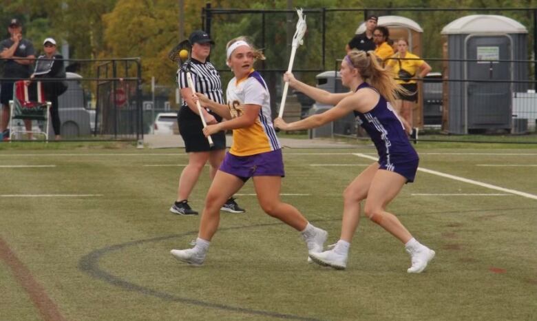 Taya Keast, far right, has had lacrosse in her family for generations. She said she was first introduced to the sport by her dad who still coaches. 