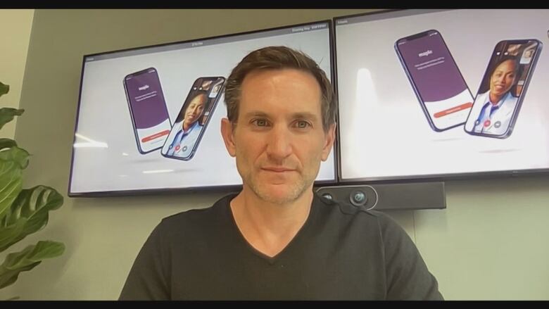 Dr. Brett Belchetz sitting in his office during a Zoom interview with CBC News.