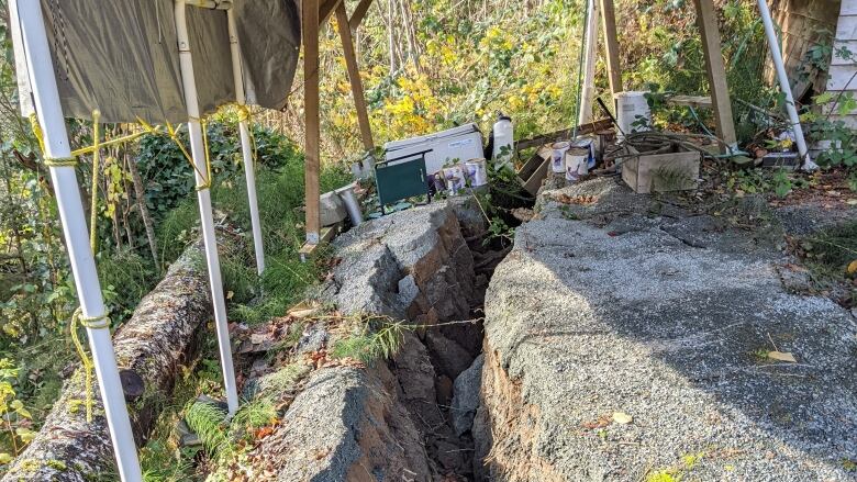 Richard Holmes and Mary-Lee Merz' carport floor cracked following landslides during the historic 2021 atmospheric river event.