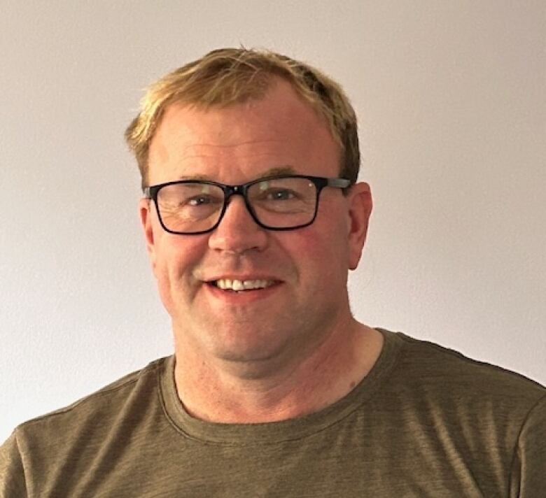 Portrait of a man with blonde hair on a blank background