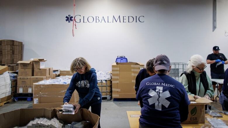 Volunteers with Global Medic prepare family hygiene kits bound for Gaza at the NGOs headquarters, in Etobicoke.