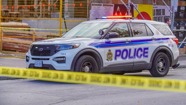 An Ottawa police cruiser parked at a crime scene.