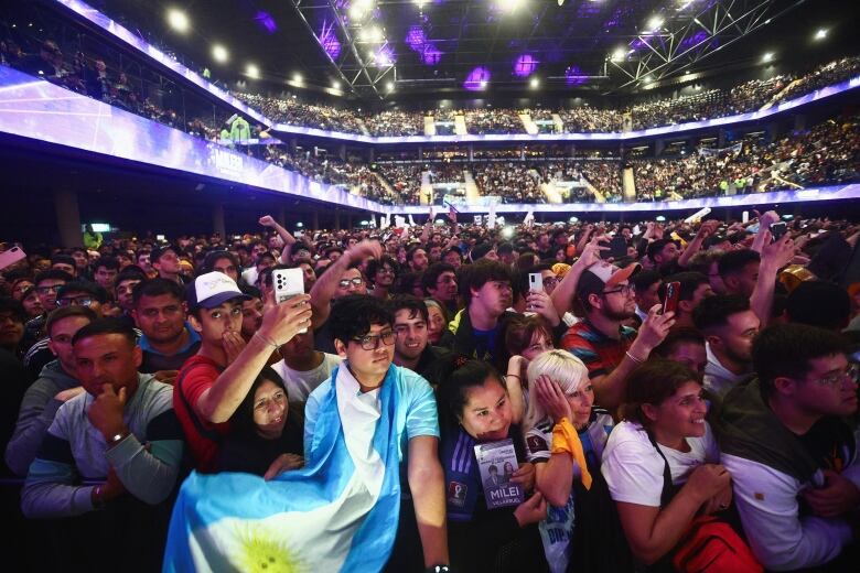 People attend a political rally in Buenos Aries, Argentina.