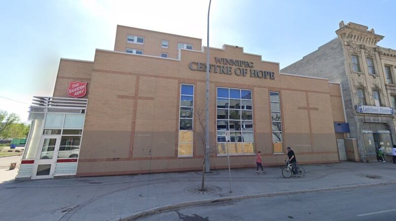 Exterior image of a brown brick building that says Winnipeg Centre of Hope on it