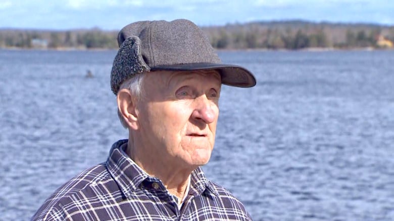 A man in a brimmed hat.