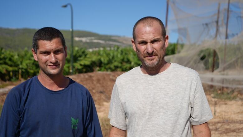 Two men on a farm.