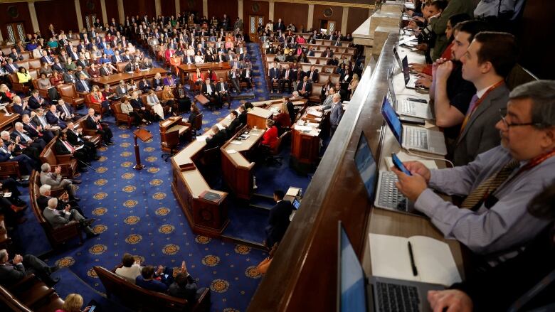 Crowded chamber, seen from packed gallery in second floor