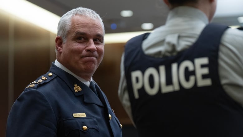 Royal Canadian Mounted Police Commissioner Michael Duheme waits to appear at the Standing Committee on Access to Information, Prvacy and Ethics on the decision not to pursue a criminal investigation into the SNC-Lavalin affair, in Ottawa, Monday, Oct. 23, 2023. 