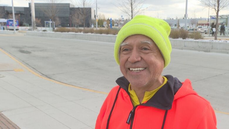 Man smiles at LRT station