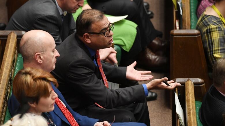 People sitting in Britain's Parliament