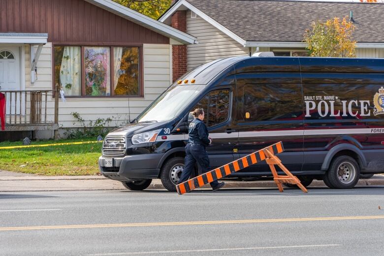 A police forensic unit attends a crime scene on Second Line, in Sault Ste. Marie, Ont., 