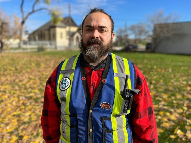 A man in a vest. 