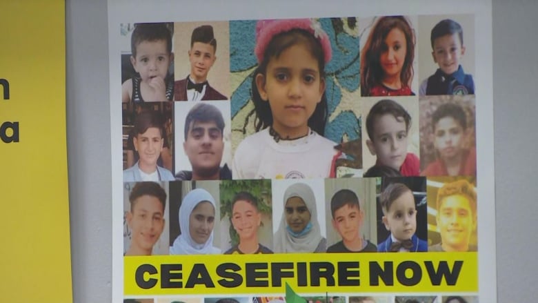 Faces of children plastered on a poster by the Palestine House Toronto.