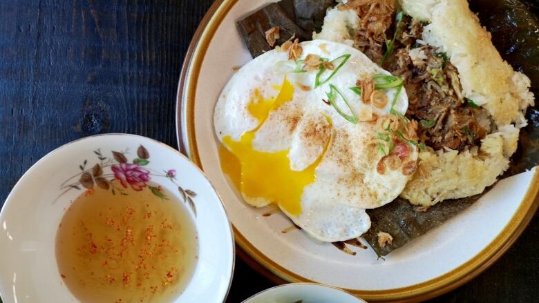 Vietnamese breakfast of steak and egg with sticky rice