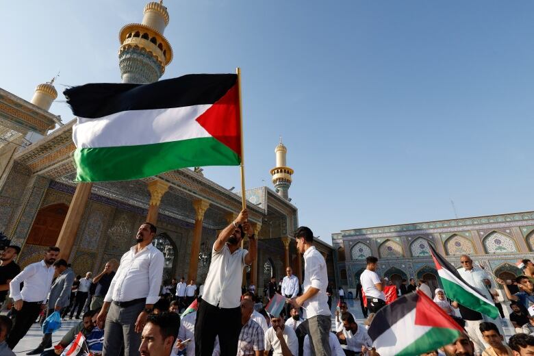 People gather in Baghdad to show solidarity with Palestinians in Gaza.