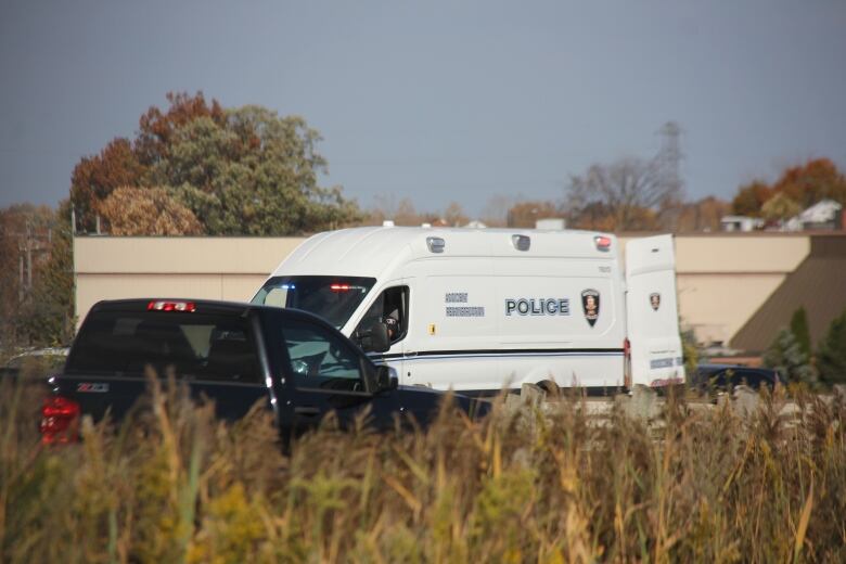 A Windsor police accident reconstruction vehicle is shown at the scene of a fatal crash involving two motorcycles on the E.C. Row Expressway.