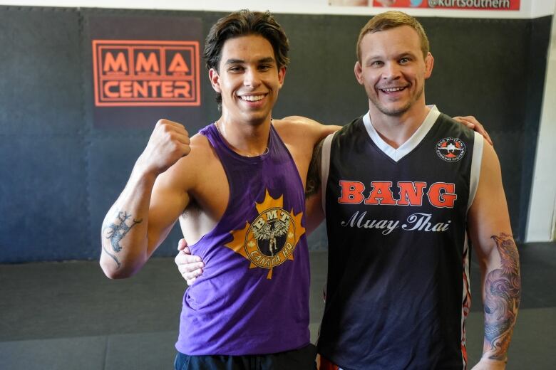 Lucas Oanta poses with his coach Kurt Southern, who's been training him since he was 12. 