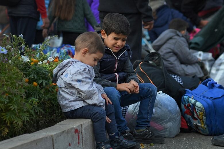 Children on a curb. 