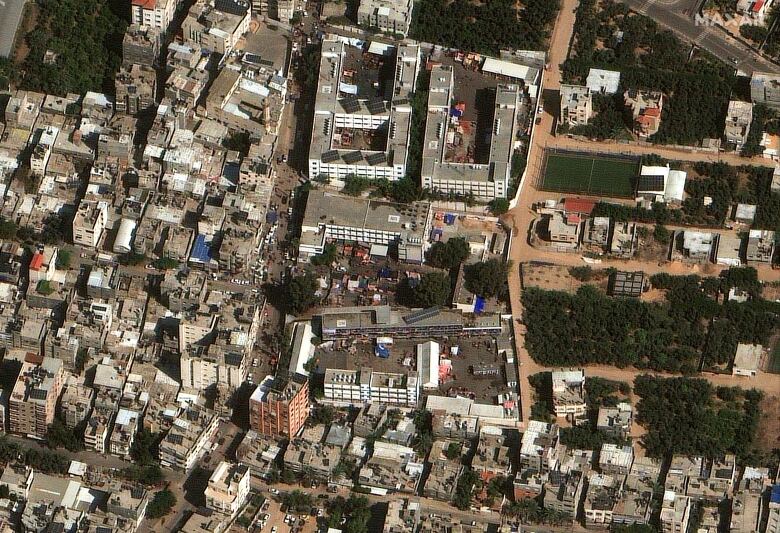 A satellite still of people sheltering at a school in Gaza City.