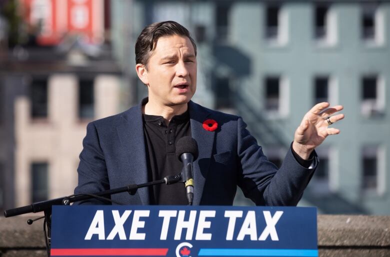 Conservative Leader Pierre Poilievre holds a press conference regarding his Axe the Tax message from the roof a parking garage in St. Johns.