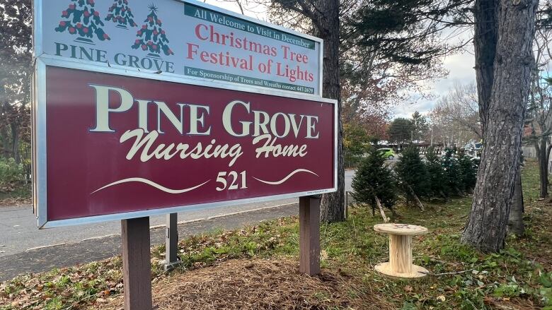 A wire spool and the pine grove sign