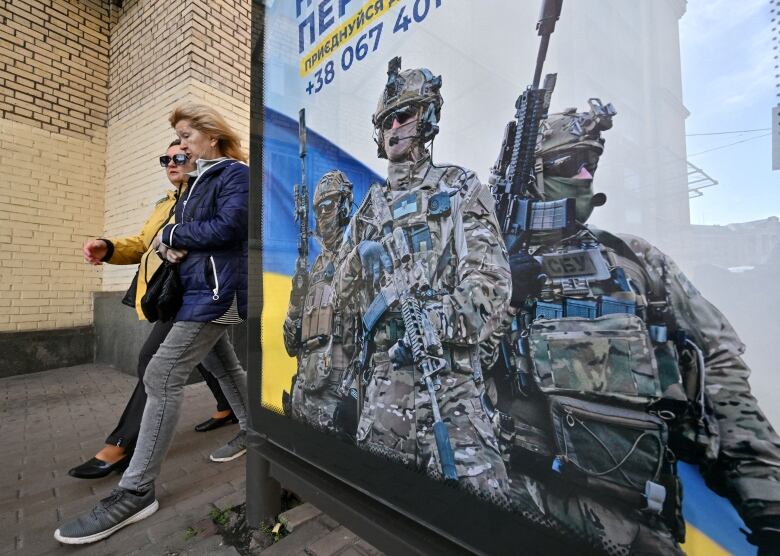 A poster depicting Ukrainian soldiers is seen in Kyiv in October 2023.