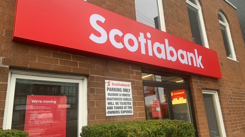 A brick building with a red Scotiabank sign.