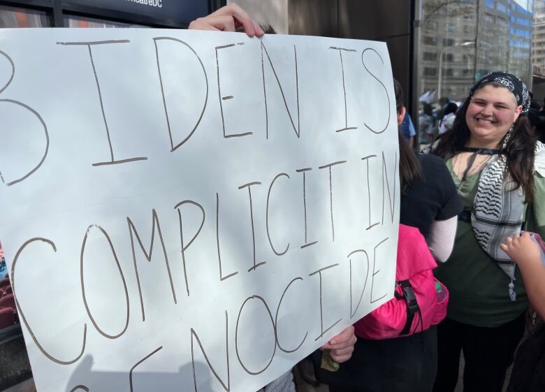 Sign says Biden is complicit in genocide