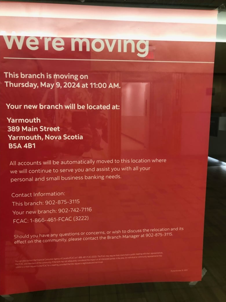 A red sign posted at the Scotiabank in Shelburne, N.S., advises that the branch is closing in May 2024 and customers should use the branch in Yarmouth.