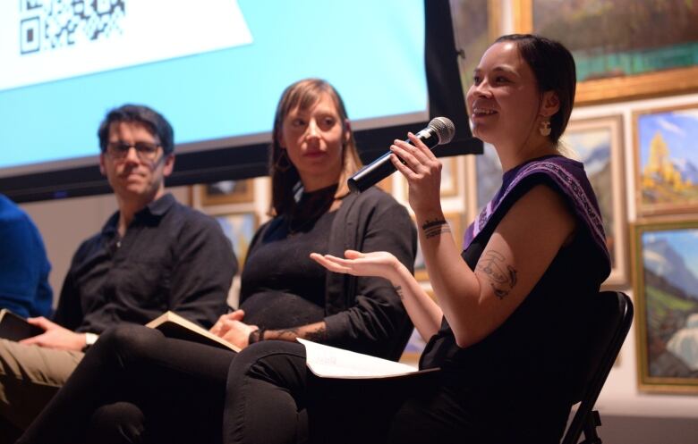 Megan Dicker Nochasak is pictured speaking in Banff Alta. 