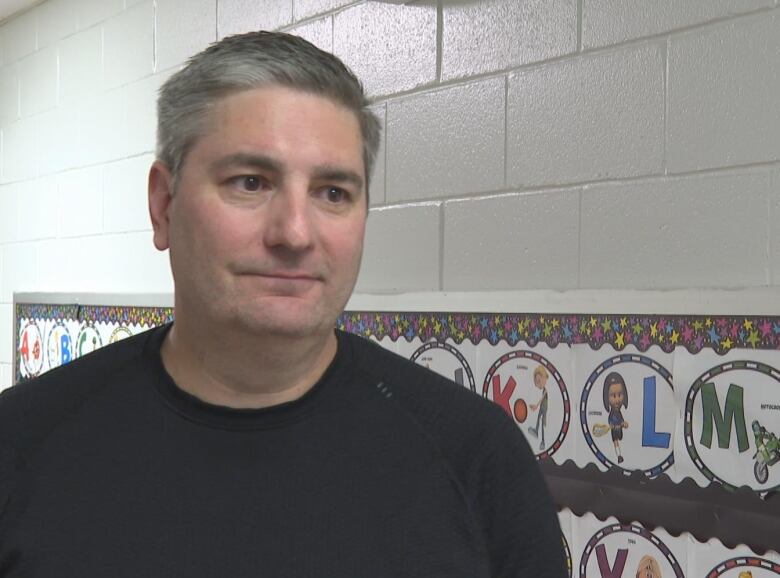 ATV Federation of P.E.I president Jody Jackson in a black shirt with a small smile during an interview. 