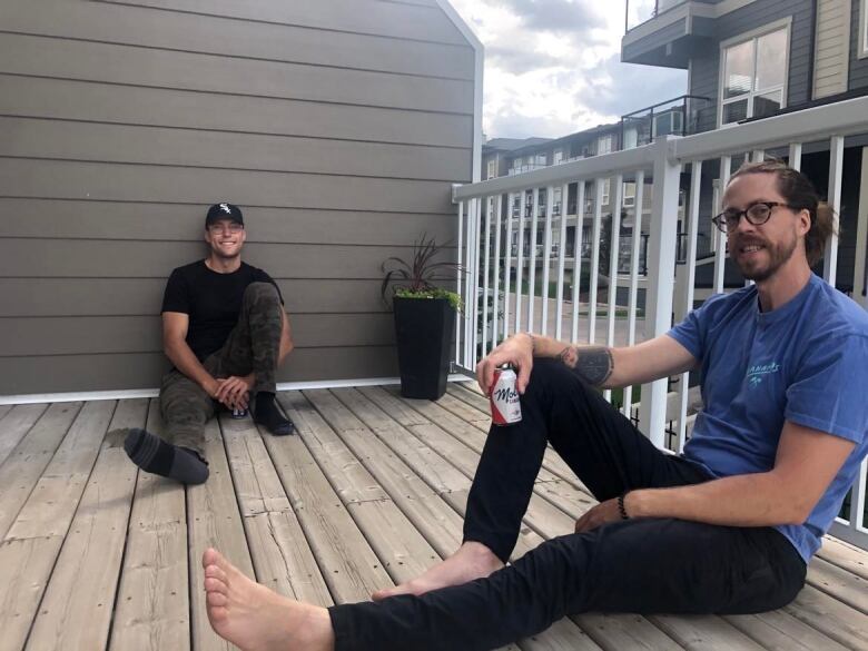 two men on a deck.