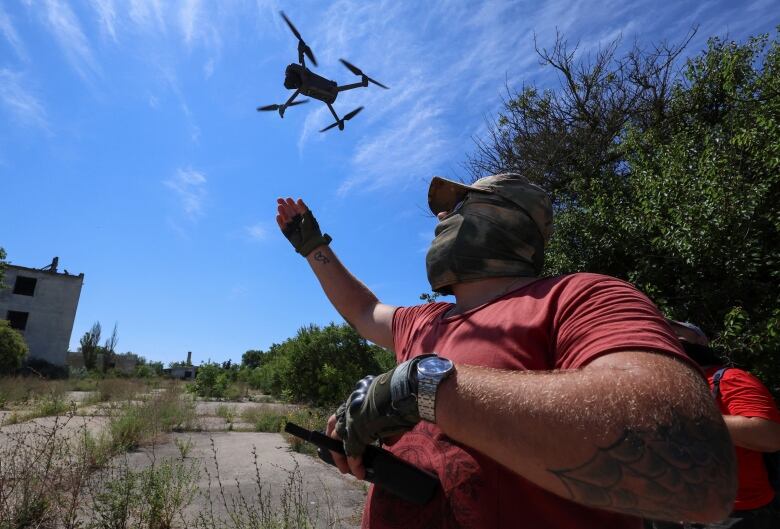 Members of a Russian territorial defence unit are seen operating drones during a training exercise in occupied Crimea, this past July.