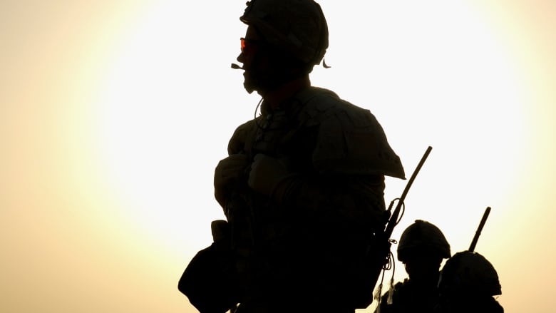 A Canadian soldier on a dawn patrol southwest of Kandahar City in March 2010.