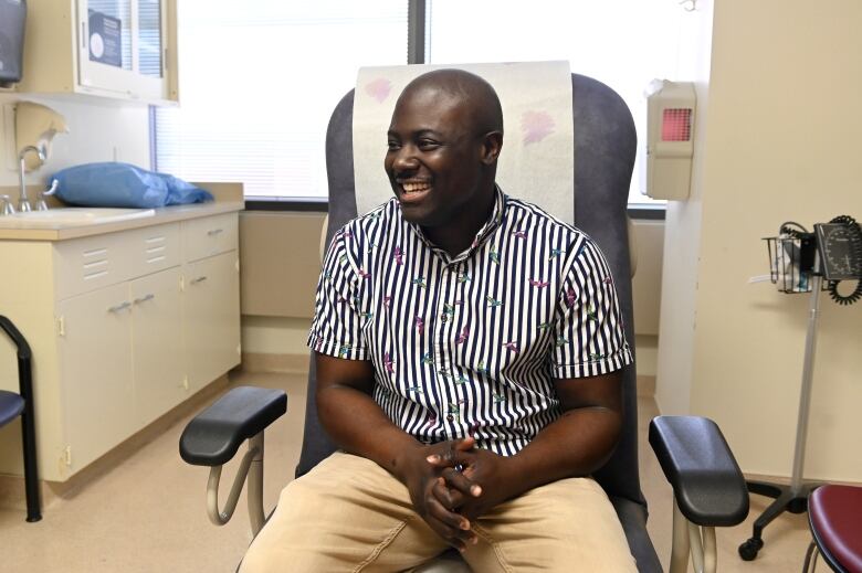 Man smiles in a clinic.