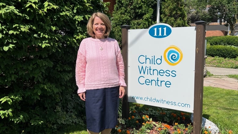 Picture of Robin Heald, the executive director of Child Witness Centre (CWC), in front of their office.