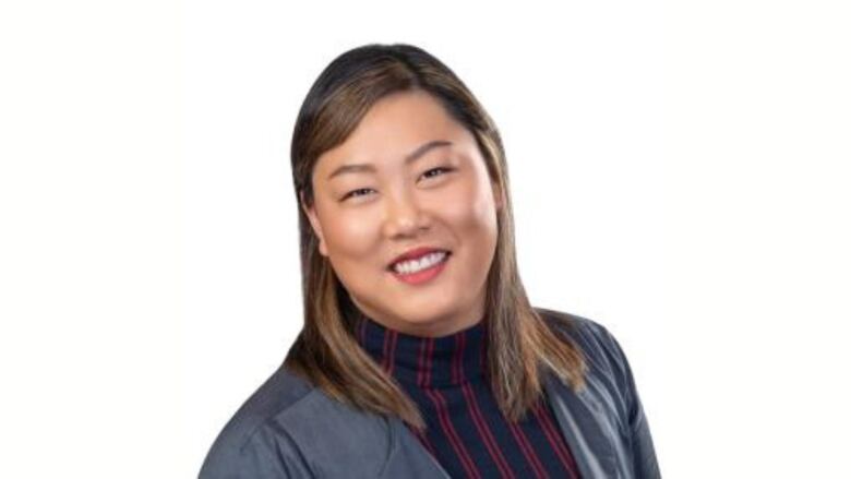 An East Asian woman smiles in a headshot.