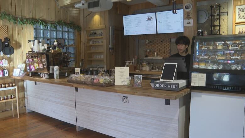 The interior of a small coffeehouse.