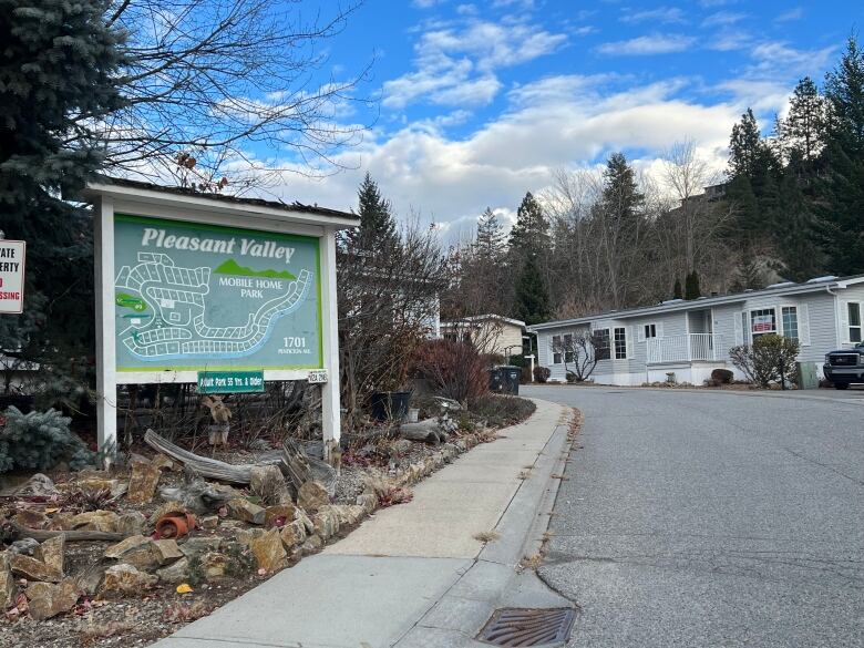 The entrance to a mobile home park with a map and the words 'Pleasant Valley Mobile Home Park' on it.