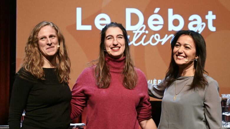 Three people posing for a photo.