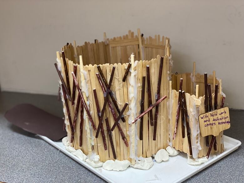 A beaver made out of popsicle sticks that represents what a warming hut will look like. 