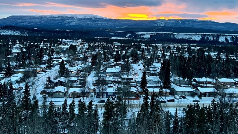 A view of Whitehorse in the snow at sunset. 