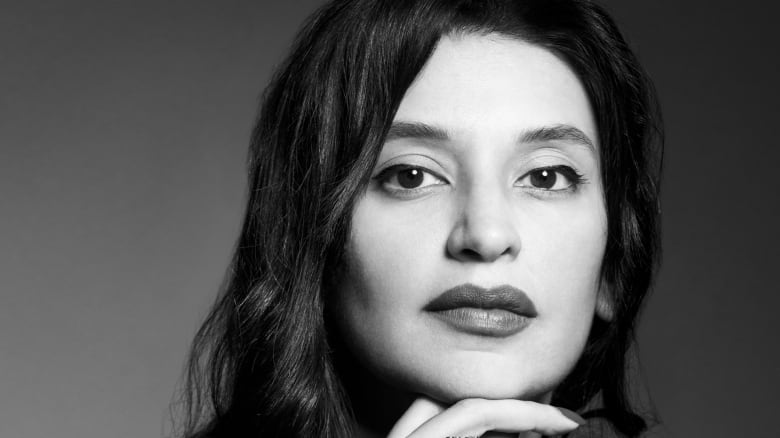 Black and white photo of Toronto author Erum Shazia Hasan.