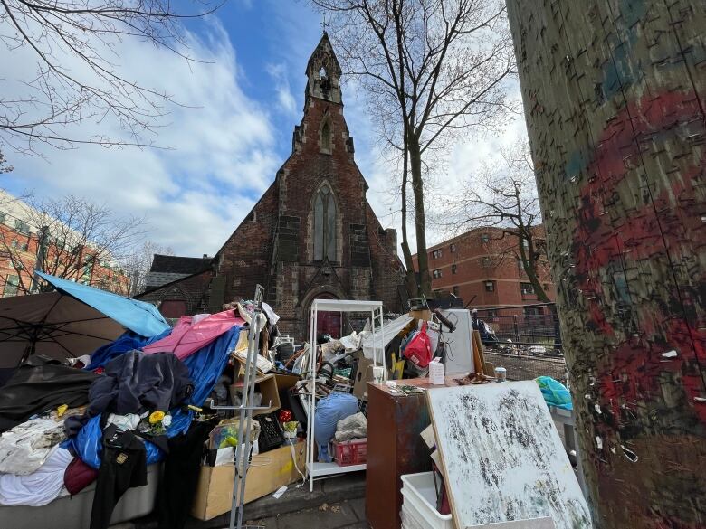 A makeshift camp made outside of a church.