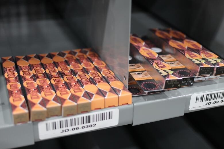 Boxes of cosmetics are pictured on a shelf in a distribution centre for Well.ca.