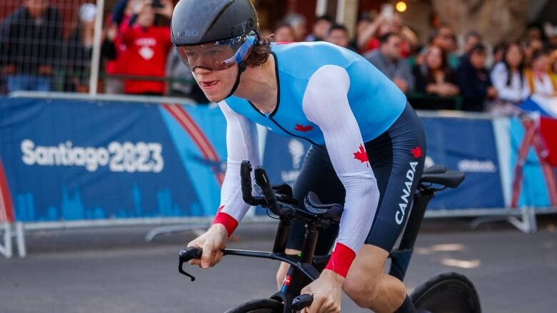 A men's Para cyclist rides during a competition.