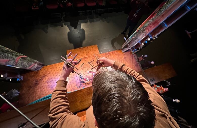 Ronnie Burkett controls each marionette with one hand.