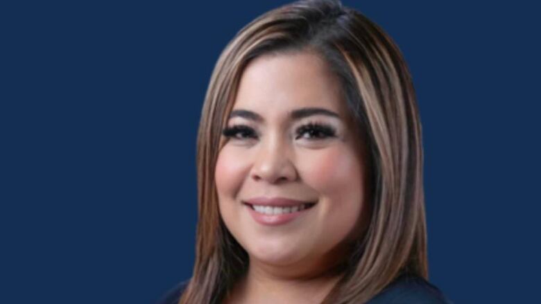 Liza Lucion, a Filipina woman with long brown highlighted hair, is shown in a headshot in front of a dark blue background.