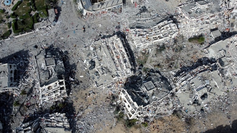 An aerial view of the ruins of an urban landscape.